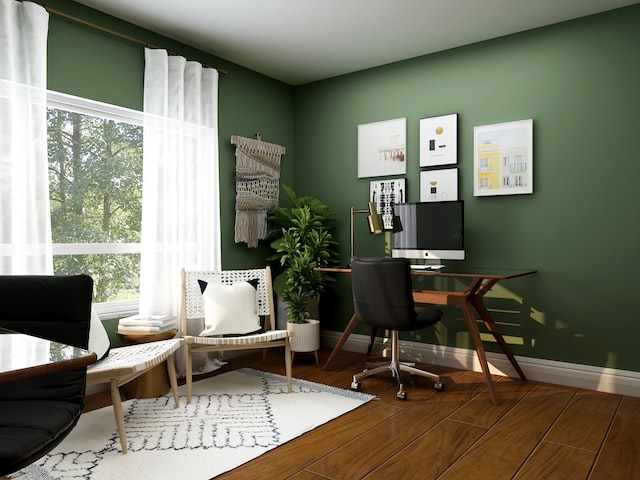 A home office with a green wall, suitable for working from home. The image is related to an article on how the short-term rental market is shaping the future of renting.