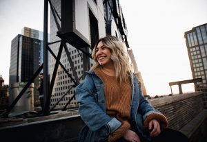 woman near billboard photo