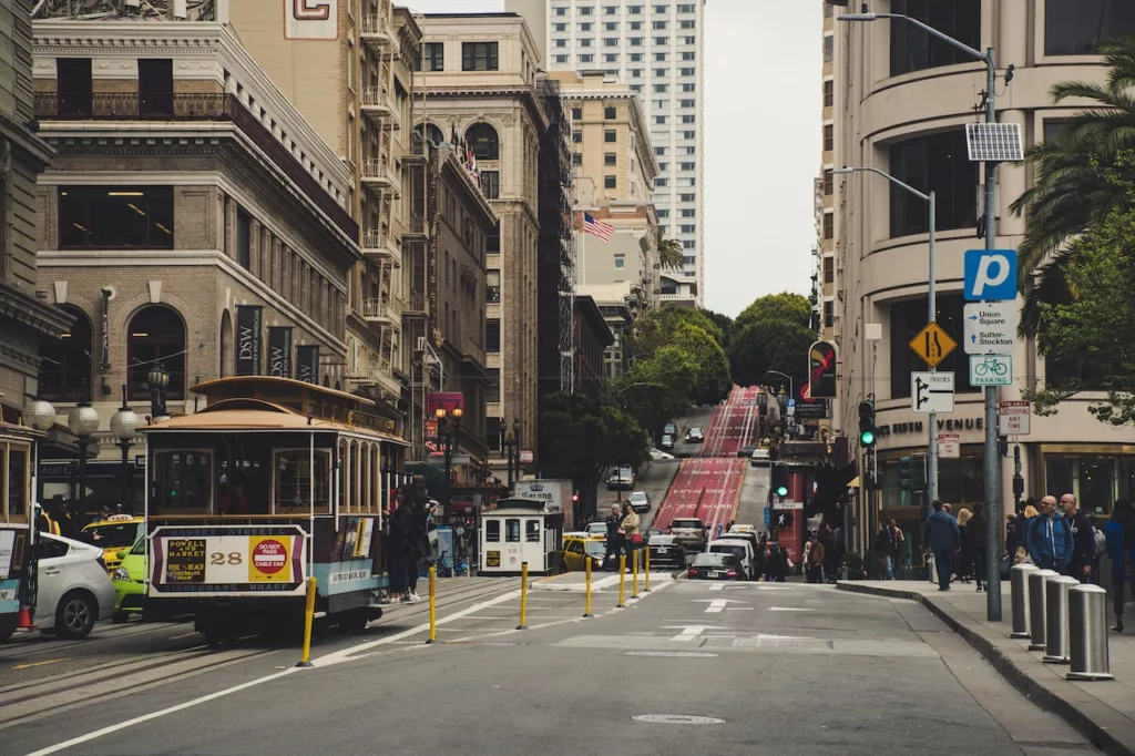 A view of a road beside buildings and a San Francisco tram, likely in an urban area that promotes car-free living.  