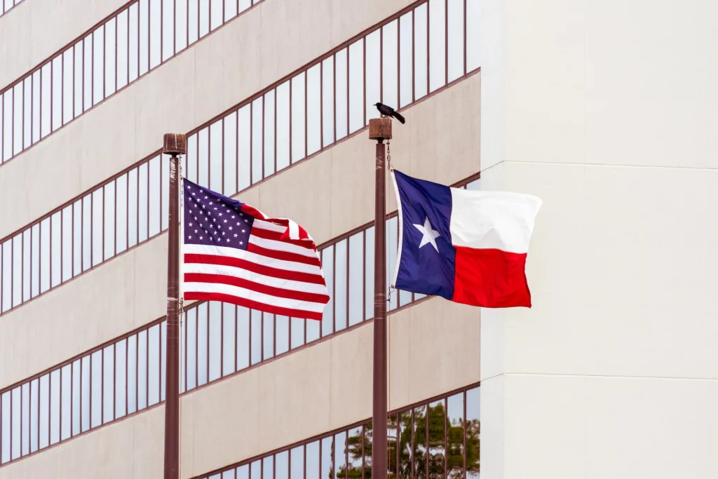 An American flag and a Texas flag.