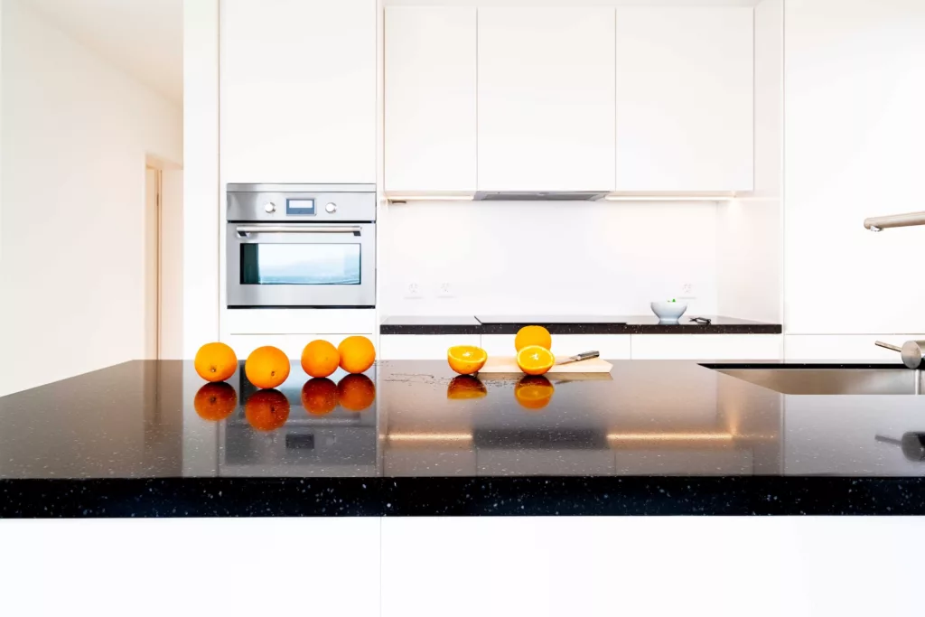 Yellow round fruits on white kitchen counter photo