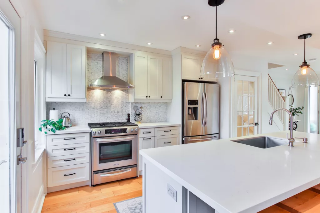 White wooden kitchen cabinet and white kitchen counter photo - Essential Kitchen Features