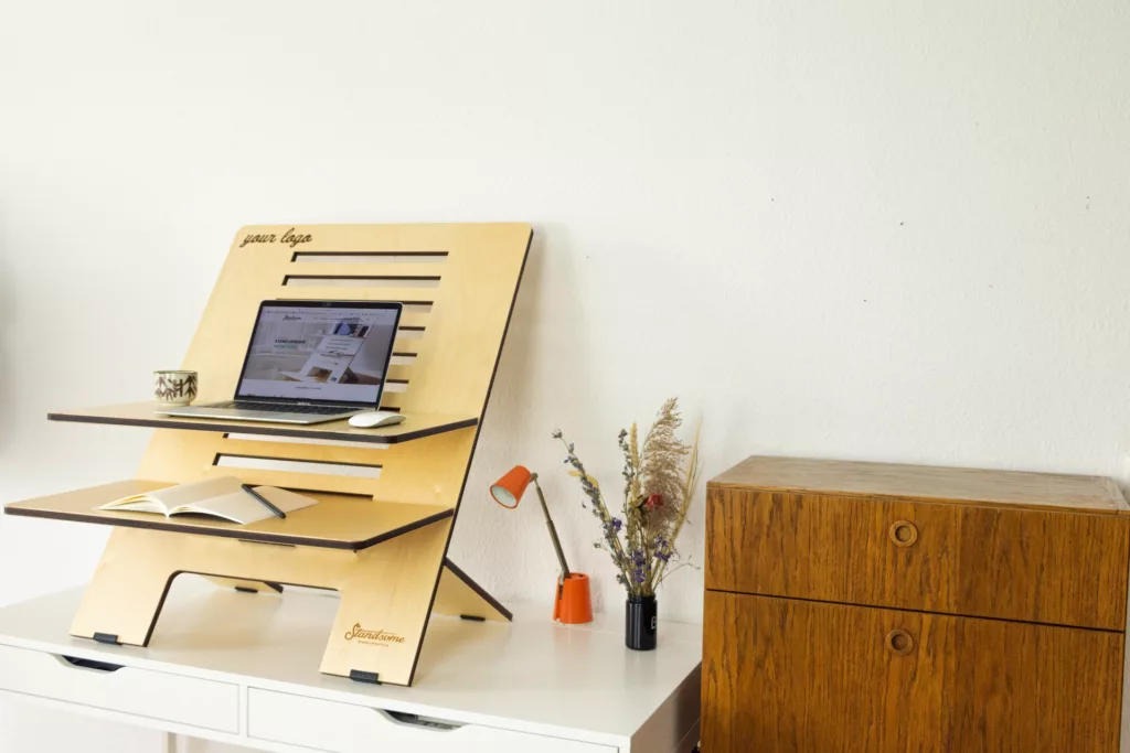 A desk with a computer on top of it photo