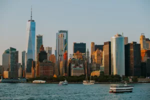 NYC City skyline across body of water during daytime photo