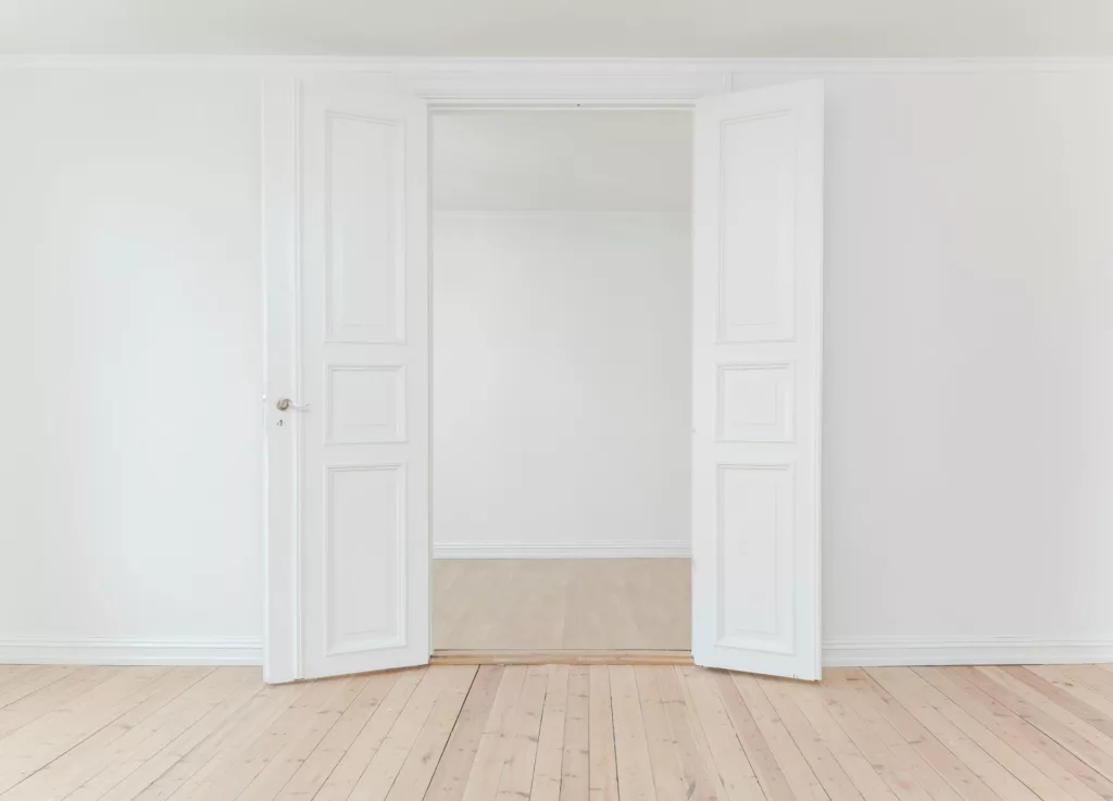 Minimalist photography of open door photo -  for How to Maximize the Value of Your Rental Property with Property Management Software article.