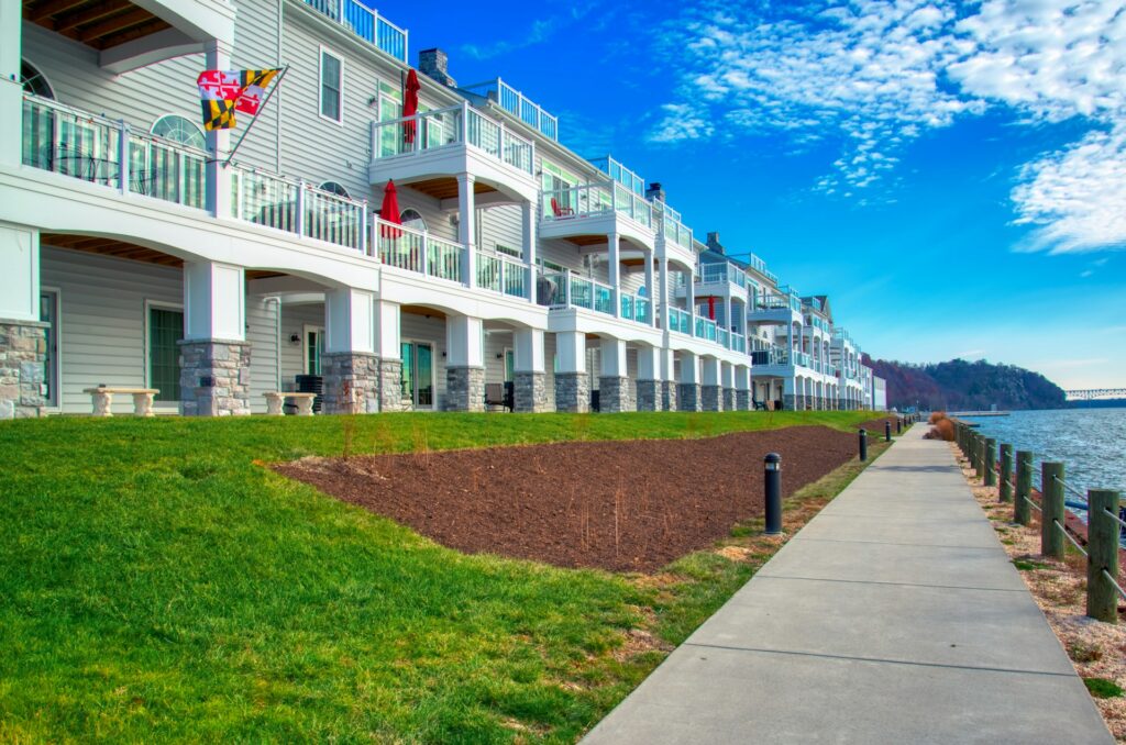 A row of Maryland apartment buildings next to a body of water photo