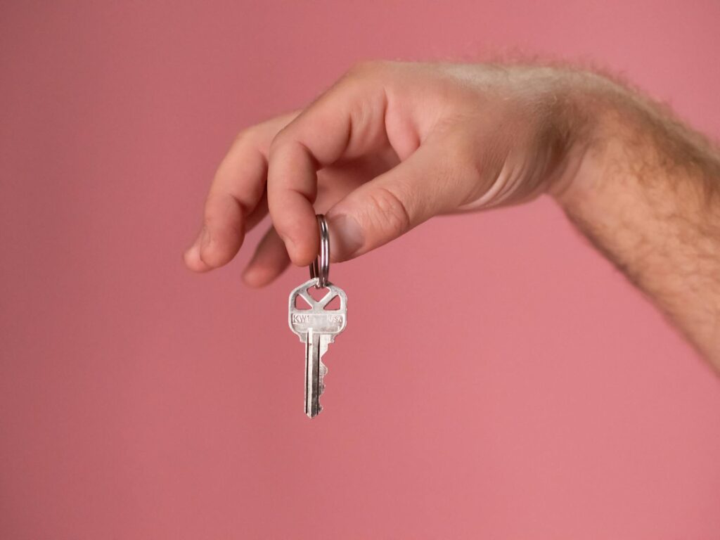 Buy vs. Rent: Person Holding a Key
